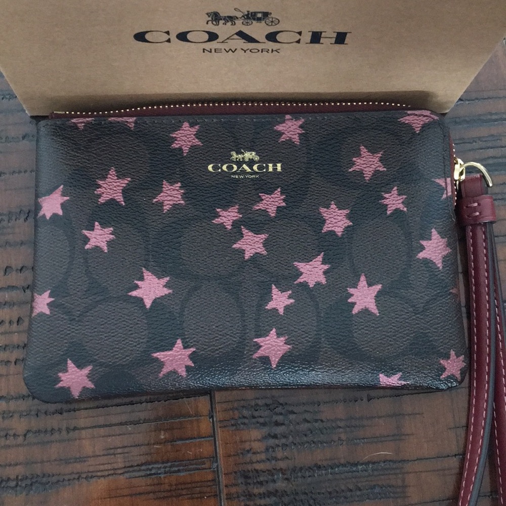 NWT Coach Wristlet Dark Brown with Mauve Stars